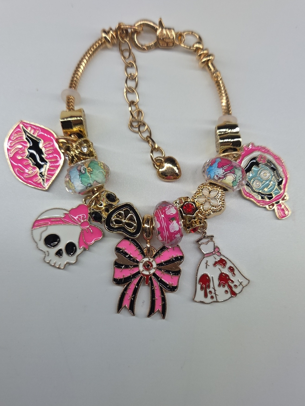 Gold-Tone Pink Charm Bracelet with Bow & Skull Accents. Pandora Style With Ext.
